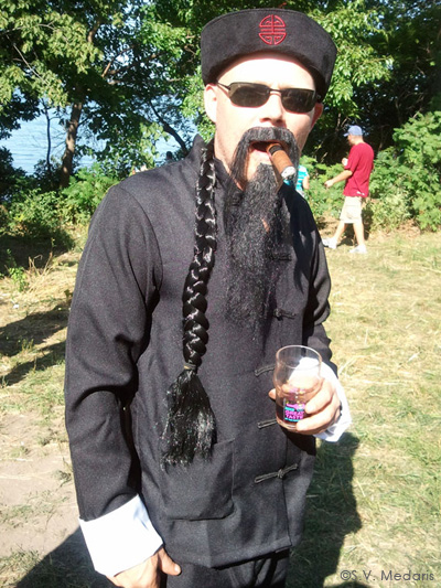 Kuhnhenn Brewing guy dressed up with braid and fu manchu